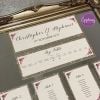 champagne glitter with purple roses table plan
